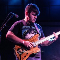 Ben Zoleski playing the acoustic guitar