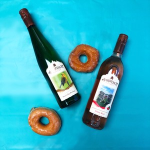 Chocolate Glazed donut and wine bottles