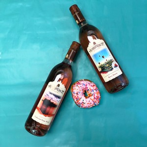 Wine bottles and strawberry donut