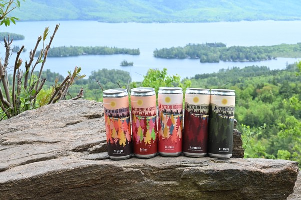 Adirondack cans with forest in the background