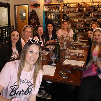 Group enjoying wine at ADK tasting room